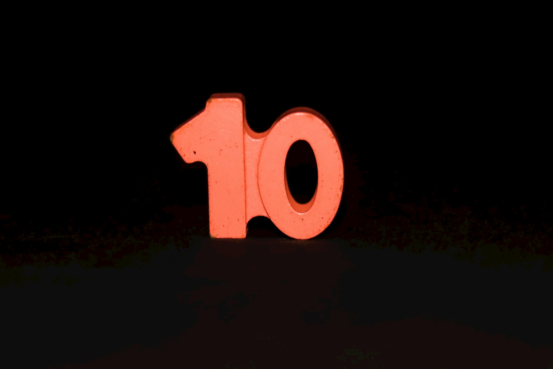 The number ten is lit up in the dark